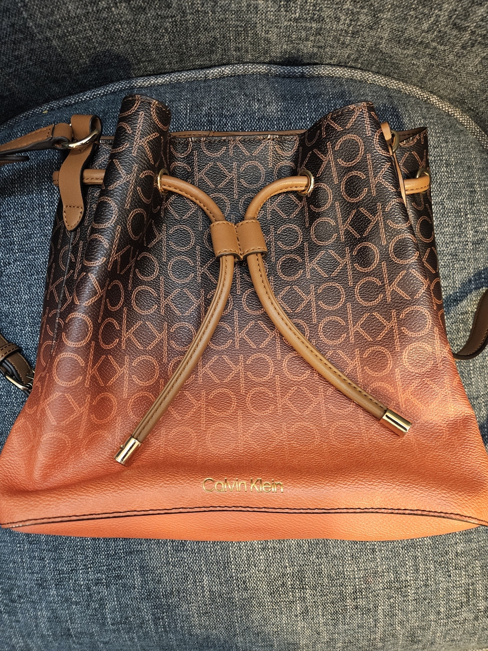 Calvin Klein Brown & Orange Gradient Monogram Drawstring Crossbody Bag - Picture 2 of 8